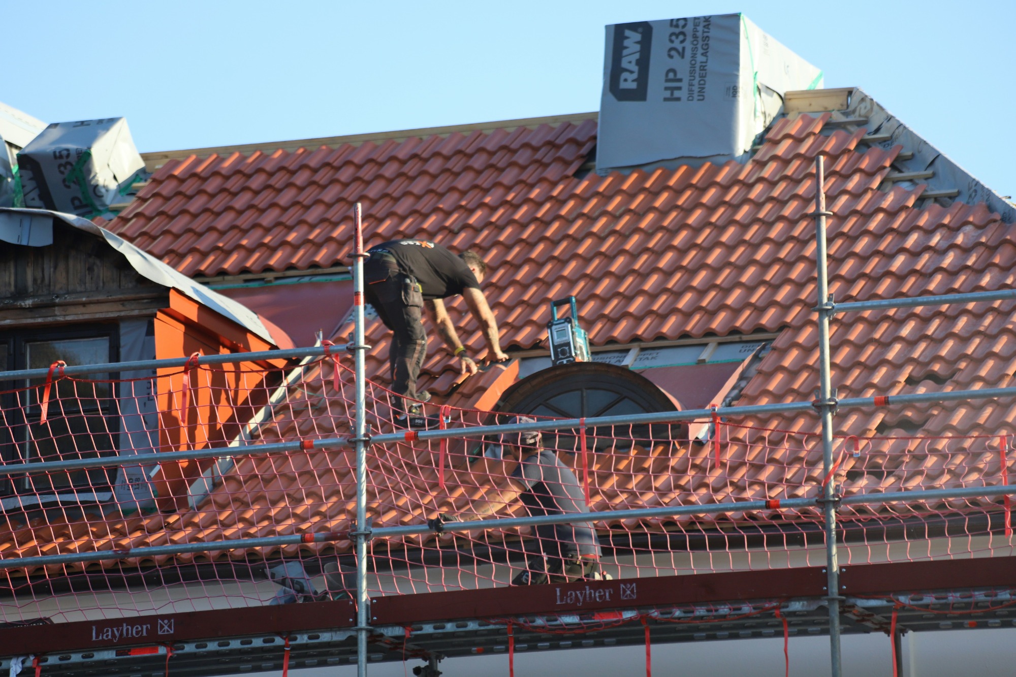Roofer working on a tiled roof
